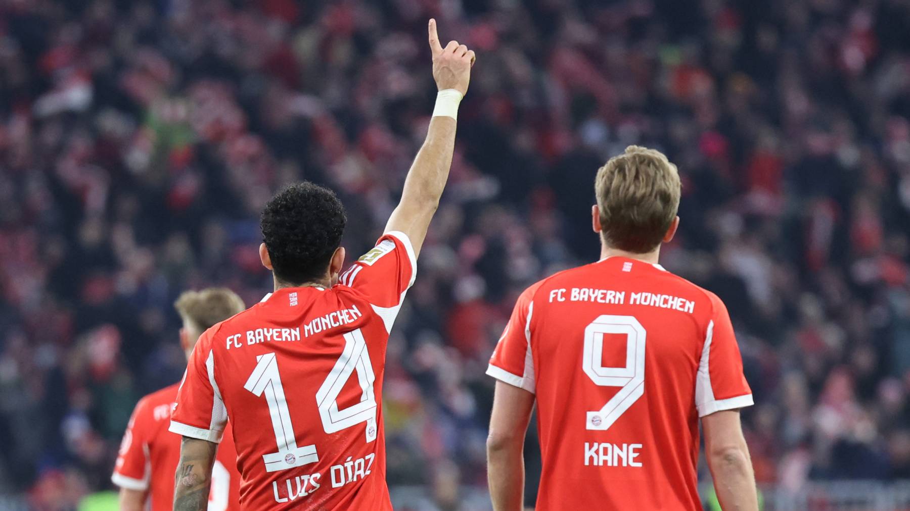 Bayern Munich's Colombian forward #14 Luis Diaz (L) celebrates with Bayern Munich's English forward #09 Harry Kane the 4-1 during the German first division Bundesliga football match between FC Bayern Munich and TSG 1899 Hoffenheim in Munich, southern Germany on February 8, 2026.